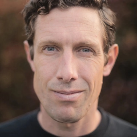 Nate English, head and shoulders, in a dark crew-neck shirt