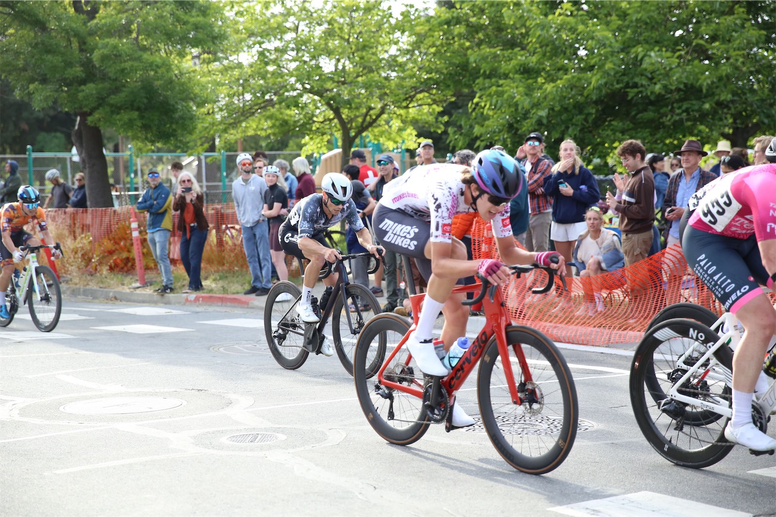 Team Mike's Bikes p/b Equator Coffees riders racing the 2026 Berkeley Streets Criterium, with spectators along the course