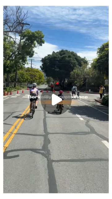 Young riders pedaling down a coned-off Berkeley street during the kids race