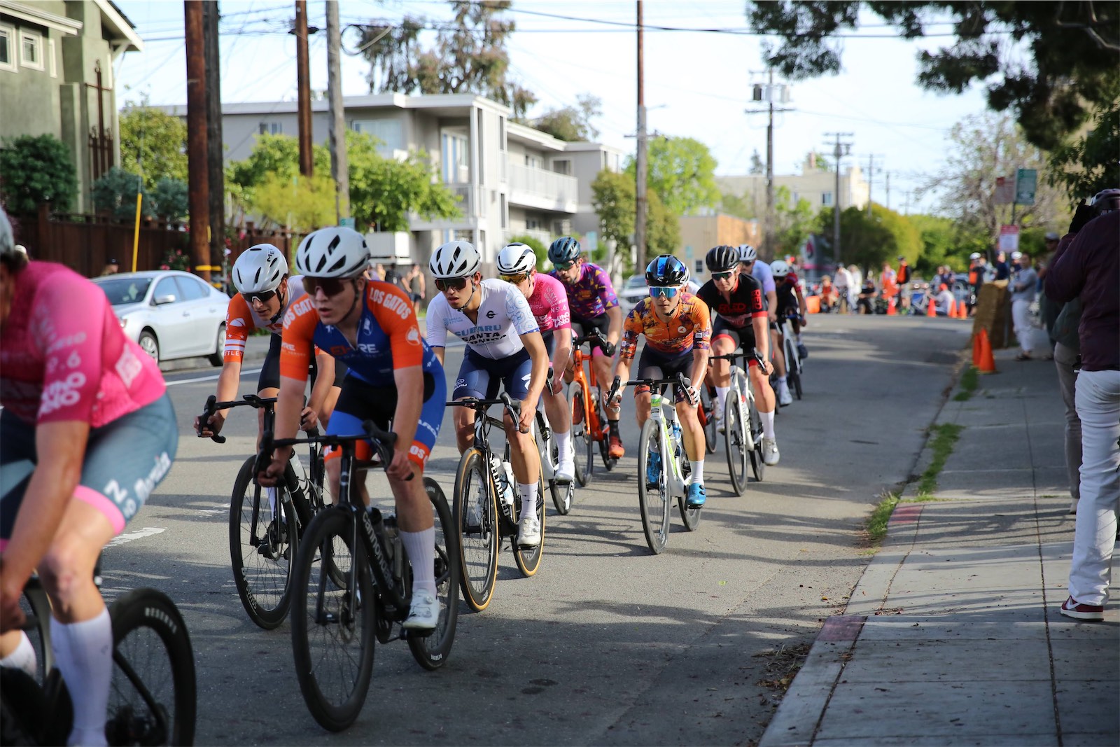 Riders racing downtown at the 2026 Berkeley Streets Criterium, Los Gatos Bicycle Racing Club among them